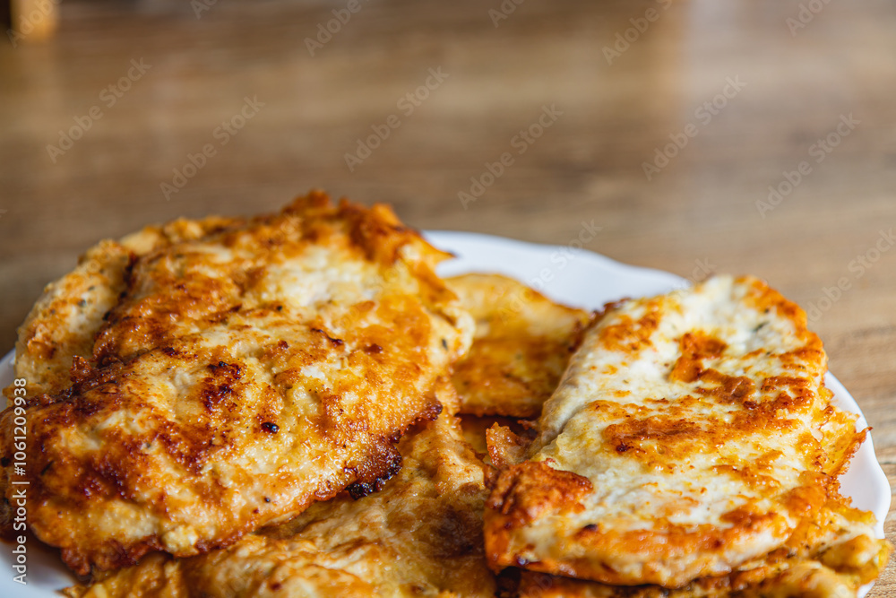 cooked chicken chops on white plate on table close up cooked chicken chops on white plate on table close up
