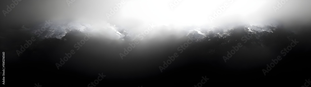 Fototapeta premium A dramatic sky with dark clouds illuminated by a bright light source, creating a moody and ethereal atmosphere that evokes a sense of mystery and awe.