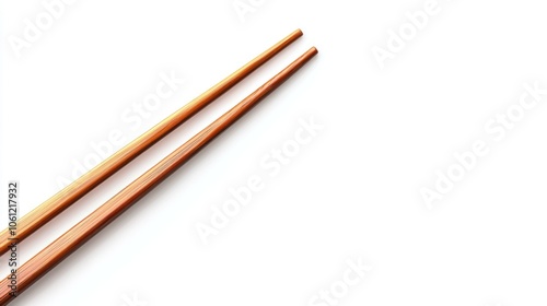 Two wooden chopsticks on a white background, ready for dining.