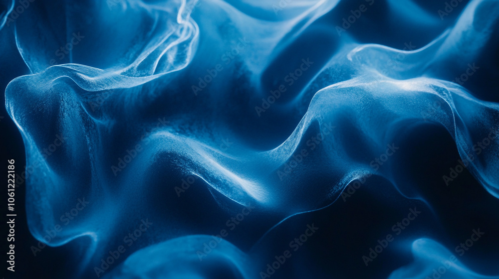 Obraz premium Abstract blue waves flowing gracefully, creating a mesmerizing pattern in a dark background