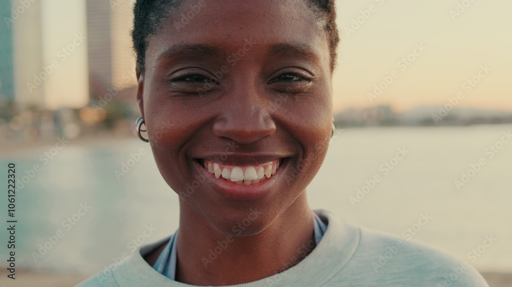 Calm young woman standing outdoor and smiling, enjoy moment of peace, mental relaxation and feels no stress concept Calm young woman standing outdoor and smiling, enjoy moment of peace, mental relaxation and feels no stress concept
