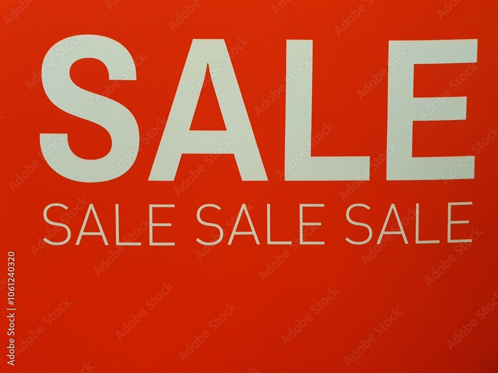Red and white Sale signage. Red and white sale sign indicating a discount at the store Red and white Sale signage. Red and white sale sign indicating a discount at the store