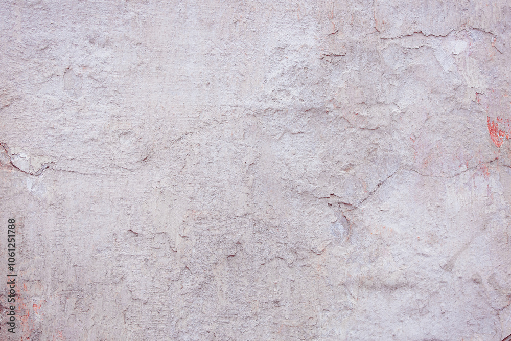 Grey peeling wall with natural defects. Fragment of the concrete shabby surface with natural texture. Red white palette of shades. Grey peeling wall with natural defects. Fragment of the concrete shabby surface with natural texture. Red white palette of shades.