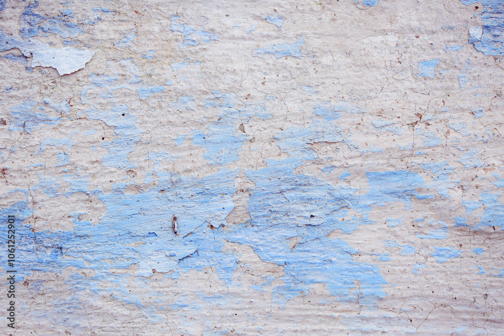 Blue peeling wall with natural defects. Fragment of the concrete shabby surface with natural texture. Blue white palette of shades. Blue peeling wall with natural defects. Fragment of the concrete shabby surface with natural texture. Blue white palette of shades.
