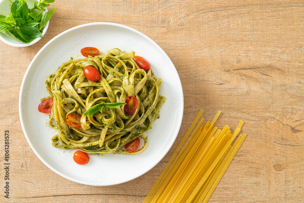 fettuccine spaghetti pasta with pesto sauce and tomatoes fettuccine spaghetti pasta with pesto sauce and tomatoes