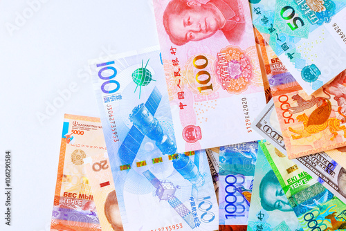 Chinese yuan, US dollars, Kazakhstani tenge banknotes are used on global scale to conduct economic activity international trade commerce photo