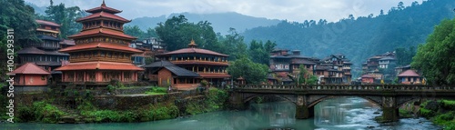 Serene landscape featuring traditional architecture near a river, surrounded by mountains.