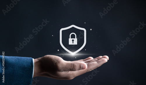 Protection network security and information security system concept, Information and cyber security technology services. Hand holding shield protect on virtual screen.