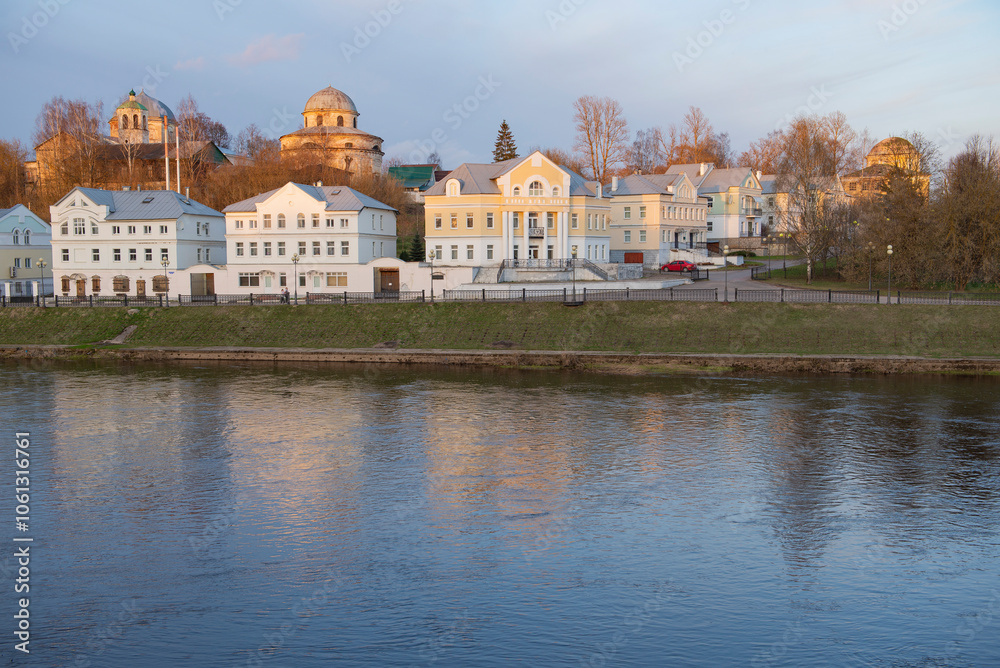 Naklejka premium View of Tveretskaya embankment on a April evening. Torzhok, Tver region. Russia