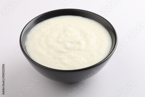 Homemade dahi doi or sour cream or curd or yogurt in a ceramic bowl. Curdled milk. Probiotic food or Probiotic dairy product. It is popular Indian dessert. photo