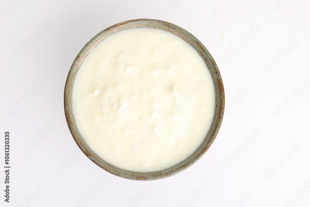 Homemade dahi doi or sour cream or curd or yogurt in a ceramic bowl. Curdled milk. Probiotic food or Probiotic dairy product. It is popular Indian dessert. Homemade dahi doi or sour cream or curd or yogurt in a ceramic bowl. Curdled milk. Probiotic food or Probiotic dairy product. It is popular Indian dessert.