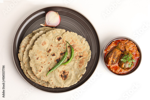 Roti or millet flat bread.Made with chana ,caun, green moong , udad ,ragi , Jowar farmer's lunch Indian bread with Brinjal curry photo