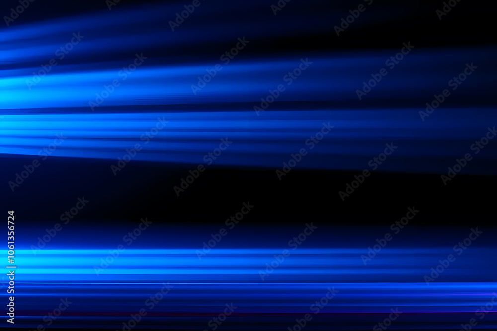 Abstract blue light streaks on a dark background, creating a sense of motion and depth. The image features smooth gradients and a dynamic flow of light, ideal for backgrounds or artistic designs. Abstract blue light streaks on a dark background, creating a sense of motion and depth. The image features smooth gradients and a dynamic flow of light, ideal for backgrounds or artistic designs.