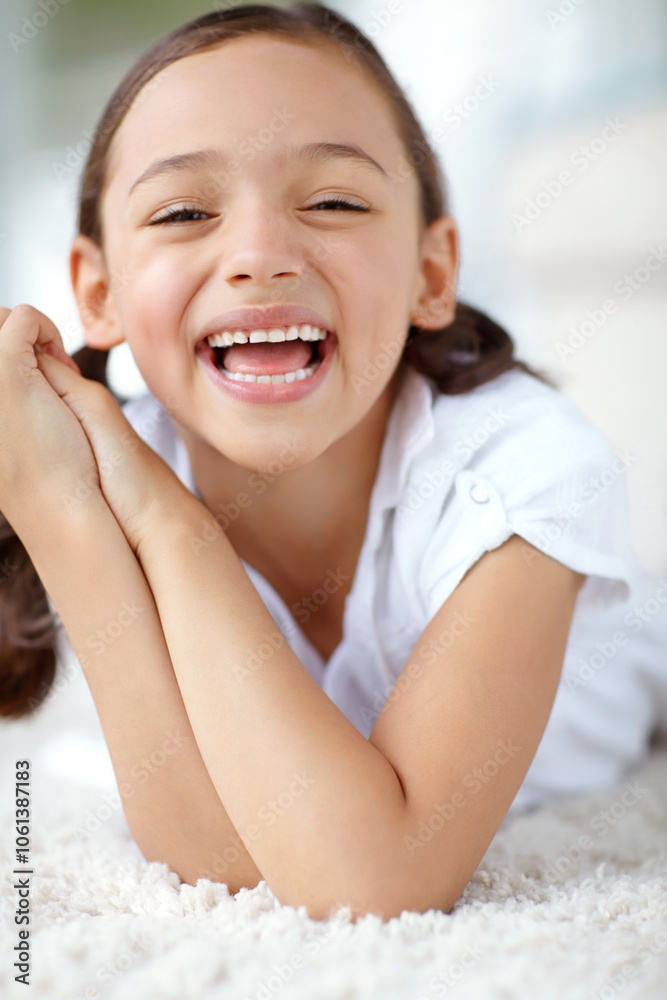 Carpet, laughing or portrait of girl in house for joy, growth and funny joke in living room of home. Smile, face or silly female kid alone with humor for happiness, satisfaction or childhood in Spain Carpet, laughing or portrait of girl in house for joy, growth and funny joke in living room of home. Smile, face or silly female kid alone with humor for happiness, satisfaction or childhood in Spain