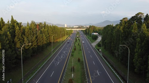 Aerial view of multi-lane highway. Fly over the big highway. Car driving on modern road top view.