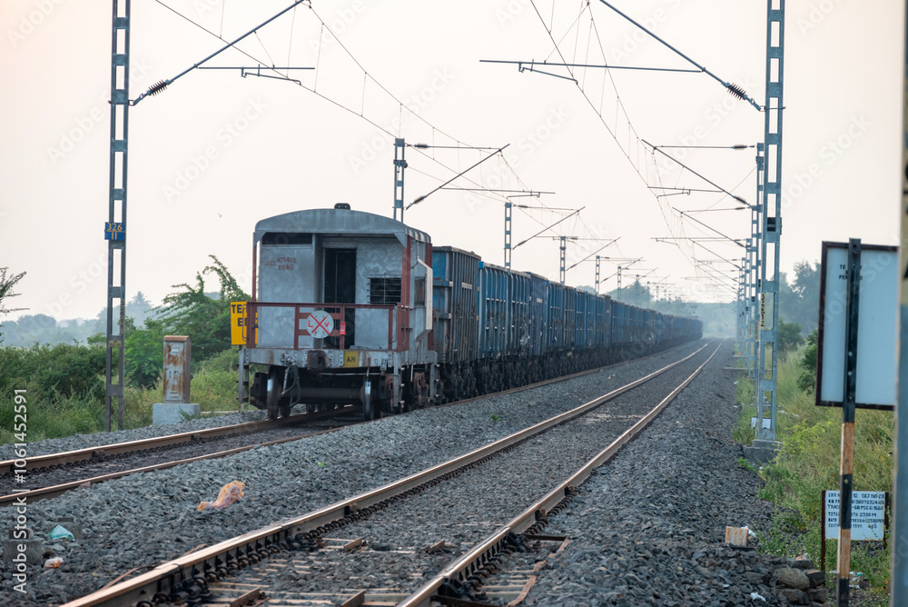 Railway track in India. Indian Railways Diesel-Electric Multiple Unit train Railway track in India. Indian Railways Diesel-Electric Multiple Unit train