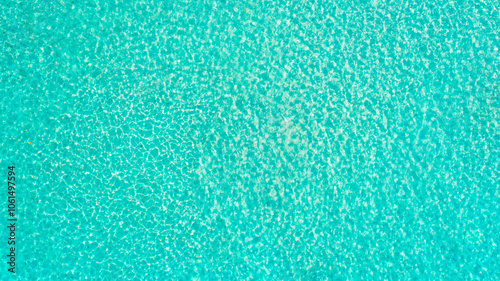 Turquoise sea wave ripple curl water surface texture. Summer holiday relax background with copy space.