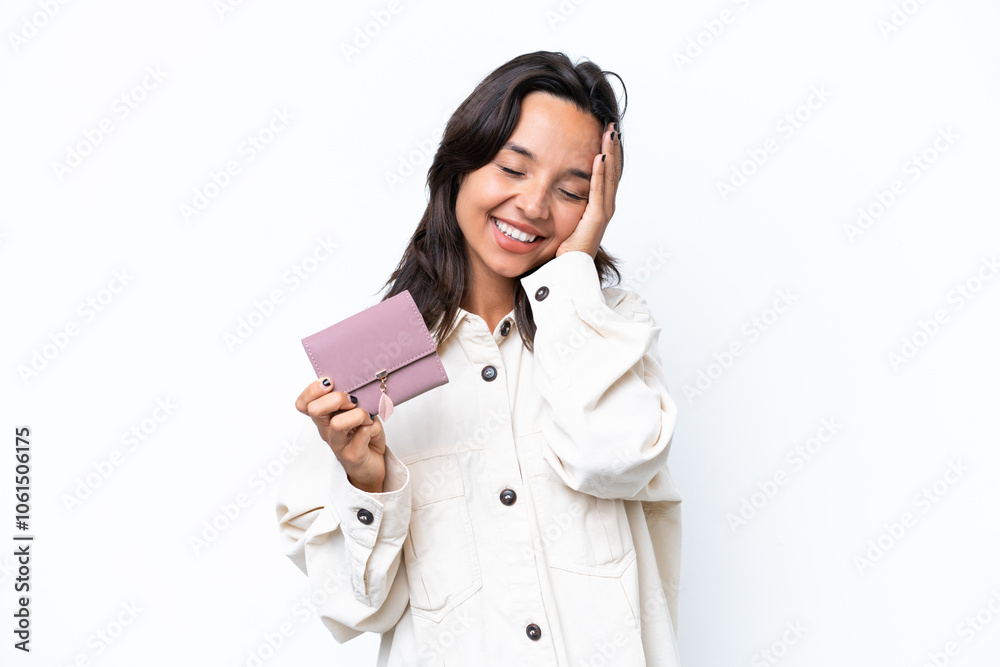 Young hispanic woman holding wallet isolated on white background smiling a lot Young hispanic woman holding wallet isolated on white background smiling a lot