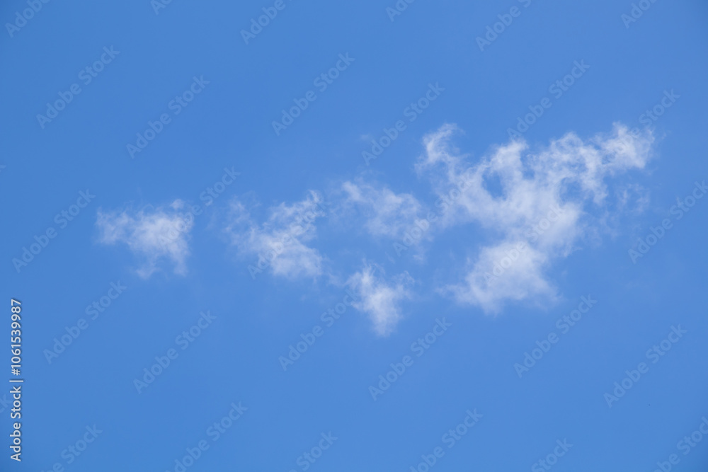 Blue sky background with tiny clouds, Nature cloud blue sky background, Blue Sky with Fluffy White Clouds on a Sunny Summer Day Blue sky background with tiny clouds, Nature cloud blue sky background, Blue Sky with Fluffy White Clouds on a Sunny Summer Day