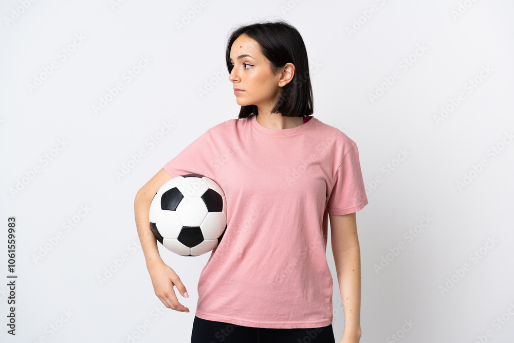 Young caucasian woman isolated on white background with soccer ball Young caucasian woman isolated on white background with soccer ball