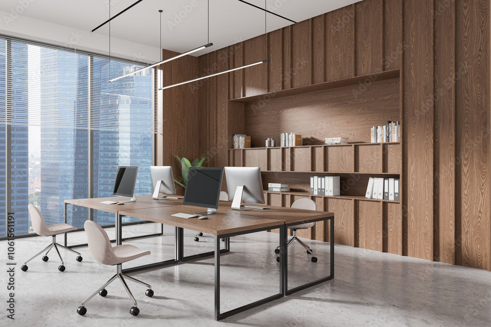 Dark coworking interior with tables and pc desktop, panoramic window Dark coworking interior with tables and pc desktop, panoramic window