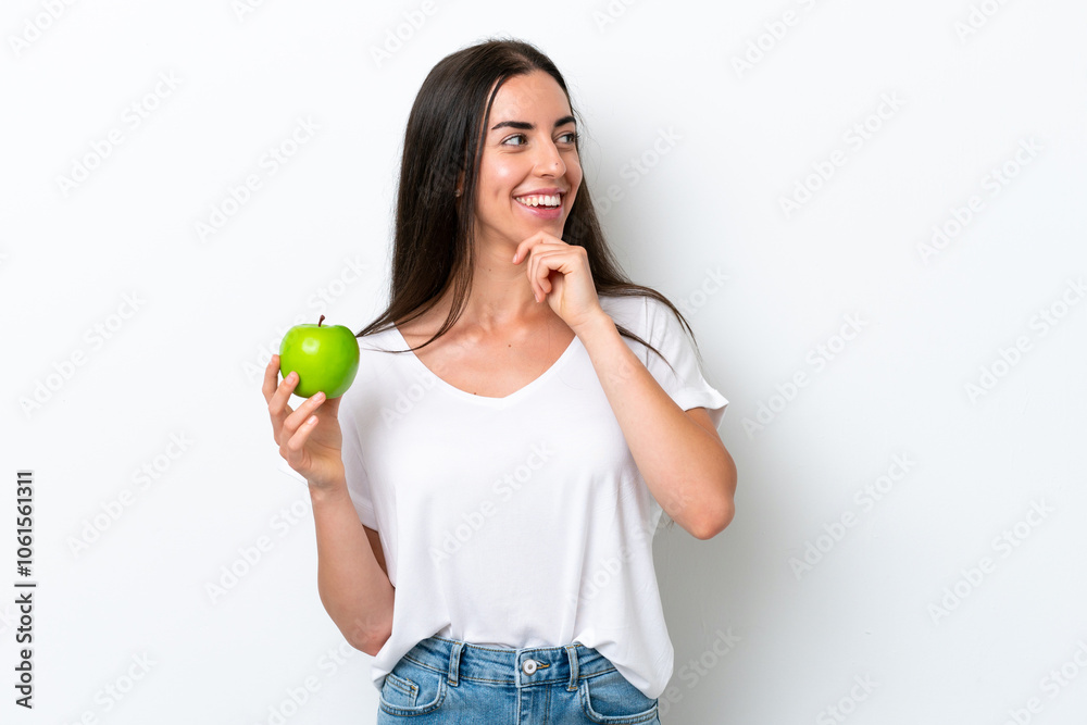 Young caucasian woman isolated on white background thinking an idea and looking side Young caucasian woman isolated on white background thinking an idea and looking side