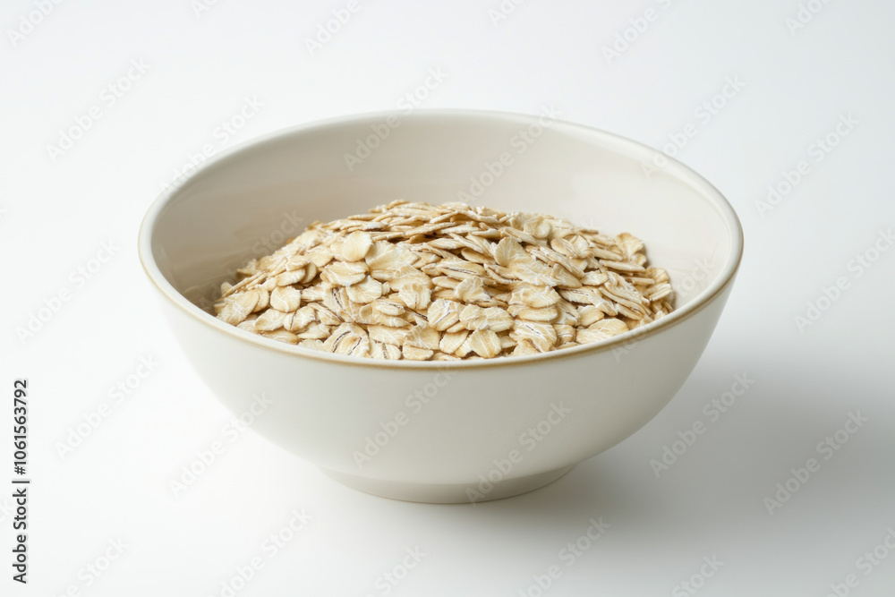 Bowl of oats on white background with blueberries, nuts, and honey drizzle. Bowl of oats on white background with blueberries, nuts, and honey drizzle.