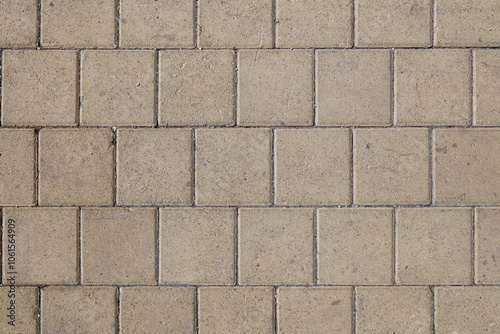 Rough textured surface of large paving slabs, close up. Pavement tile pattern, top view