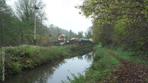 Zoom in b-roll shot of Consall railway station alongside the Caldon canal, Churnet valley, Staffordshire. photo