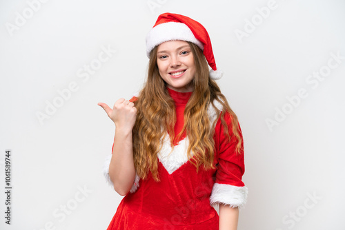 Young caucasian woman with Christmas dress isolated on white background pointing to the side to present a product