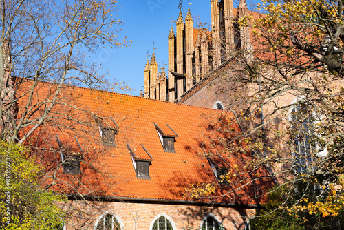 A beautiful red brick Gothic building. Ancient architecture.