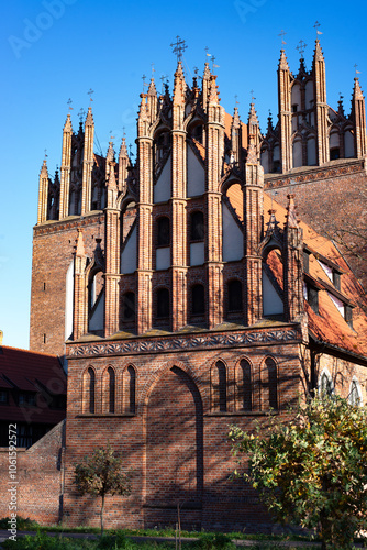 A beautiful red brick Gothic building. Ancient architecture.