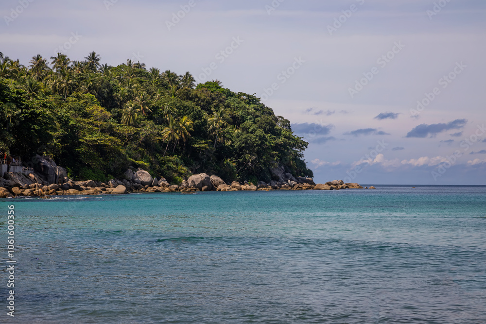 Beautiful beach with colorful water. Top view of the beautiful coastline. Sunny summer day. Colorful water. Sandy beach. Beautiful beach with colorful water. Top view of the beautiful coastline. Sunny summer day. Colorful water. Sandy beach.
