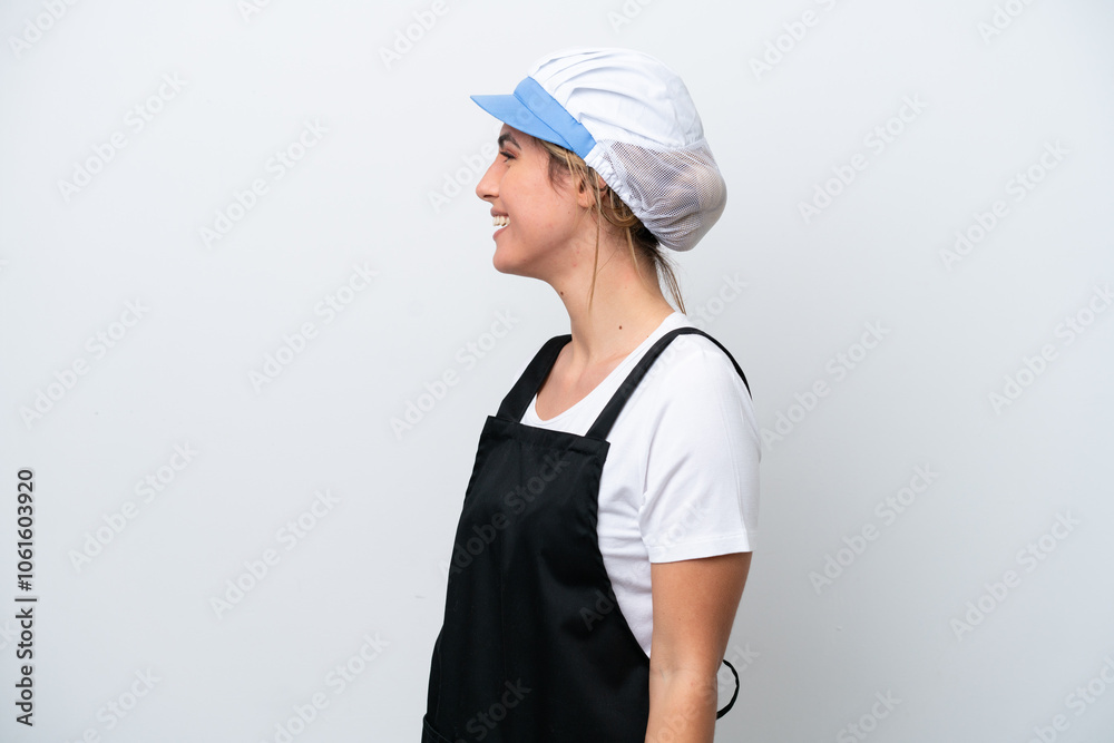 Fishwife woman isolated on white background laughing in lateral position Fishwife woman isolated on white background laughing in lateral position
