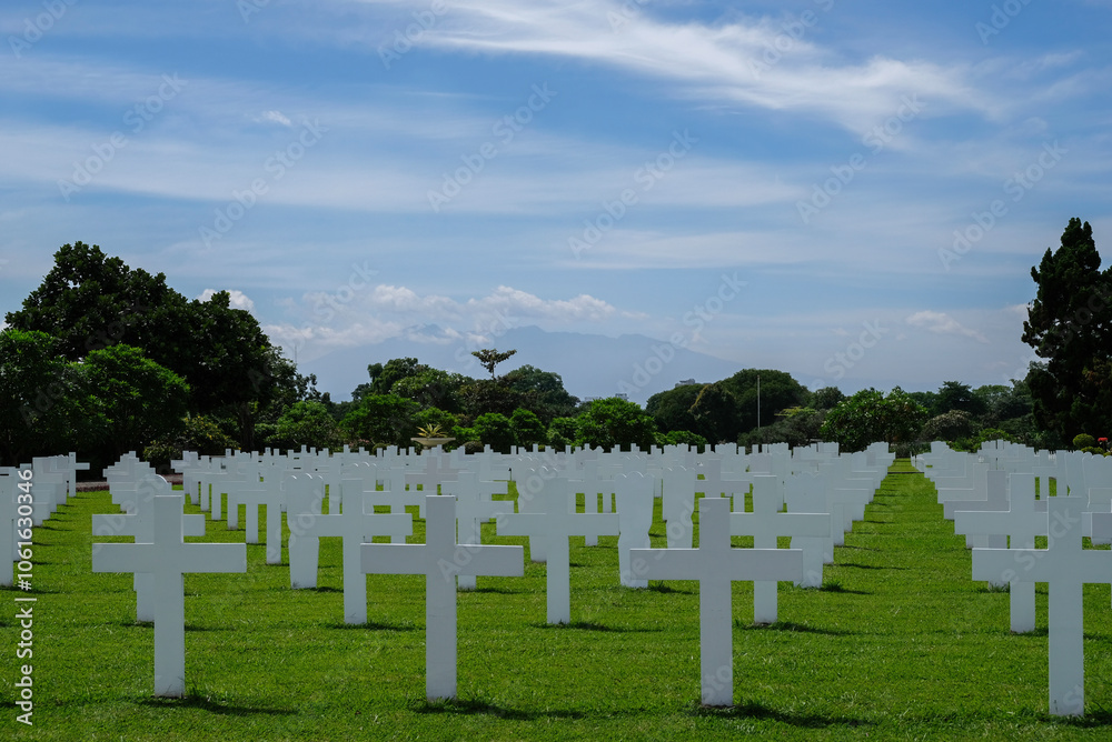 Bandung, Indonesia - January 8, 2023: Ereveld Pandu is one of 7 Netherlands war cemeteries in Indonesia where around 4000 war victims are buried. Bandung, Indonesia - January 8, 2023: Ereveld Pandu is one of 7 Netherlands war cemeteries in Indonesia where around 4000 war victims are buried.
