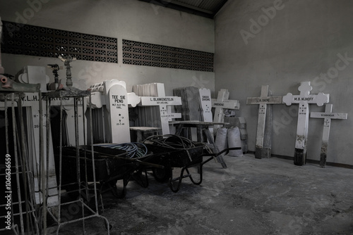 Bandung, Indonesia - January 8, 2023: The atmosphere of storage room for used grave signs at Ereveld Pandu, one of 7 Netherlands war cemeteries in Indonesia where around 4000 war victims are buried. photo