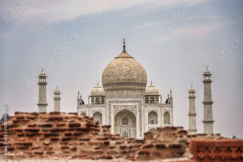 Views of the Taj Mahal through a wall in Agra photo