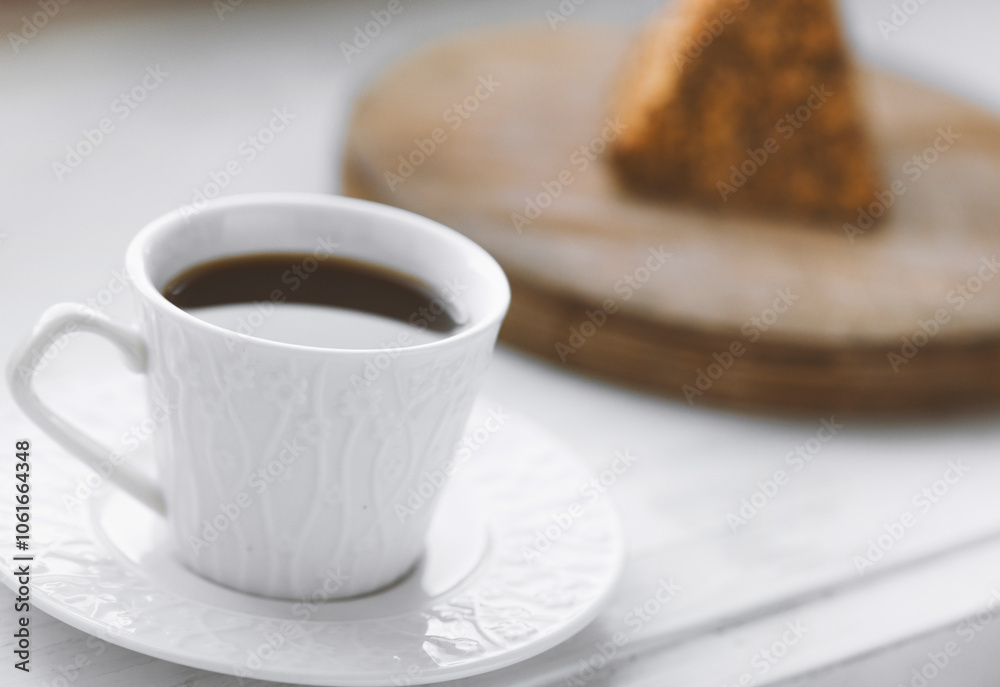 Cup of coffee and a piece of cake on a wooden board Cup of coffee and a piece of cake on a wooden board