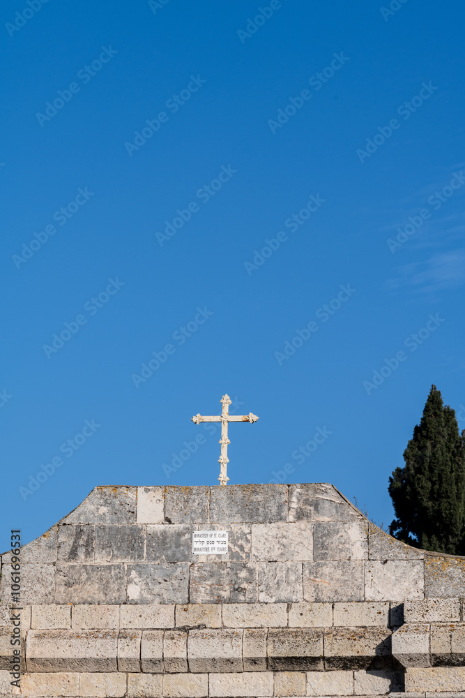 A cross atop the entrance to the Monastery of Sainte Claire in Jerusalem, Israel. A cross atop the entrance to the Monastery of Sainte Claire in Jerusalem, Israel.
