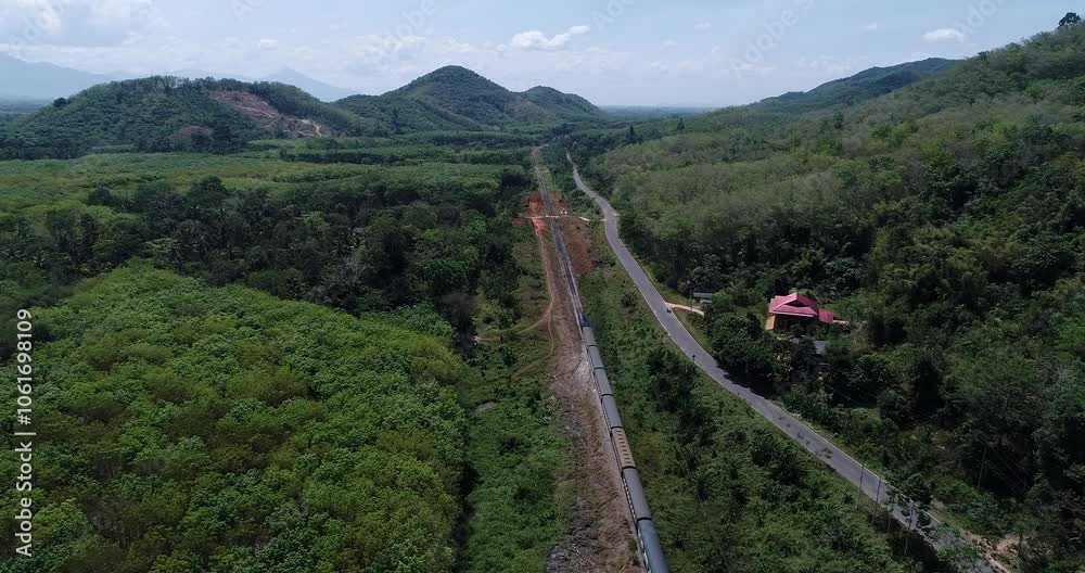 Aerial road through tropical rinforest green tree transport background Aerial road through tropical rinforest green tree transport background