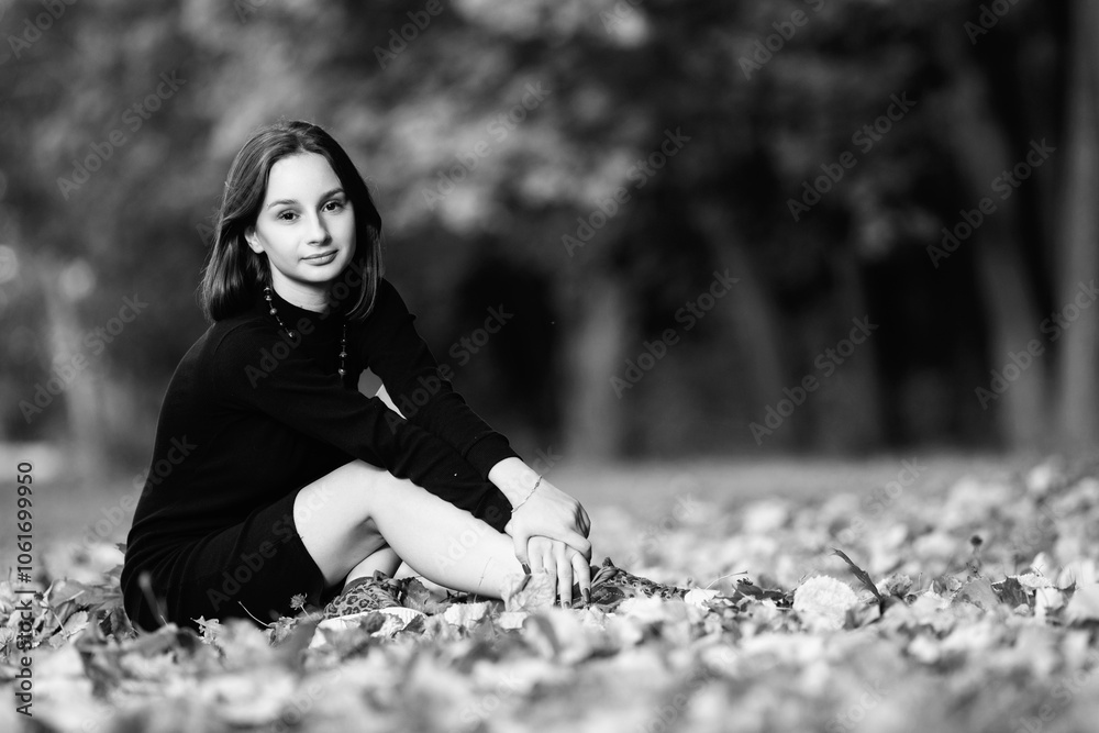 Portrait of a beautiful young girl in an urban environment. Black and white photo. Portrait of a beautiful young girl in an urban environment. Black and white photo.