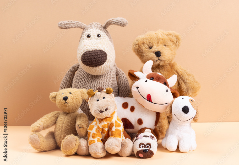 Fototapeta premium Soft toys on beige background concept of friends