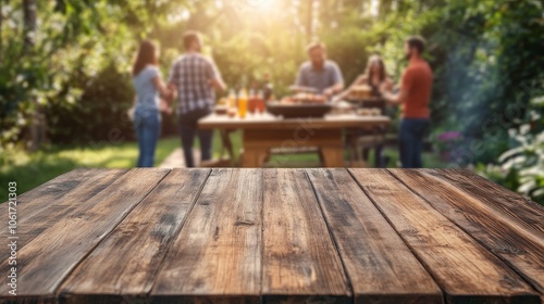 Outdoor summer bbq gathering with blurred people and a rustic wooden table in the garden photo