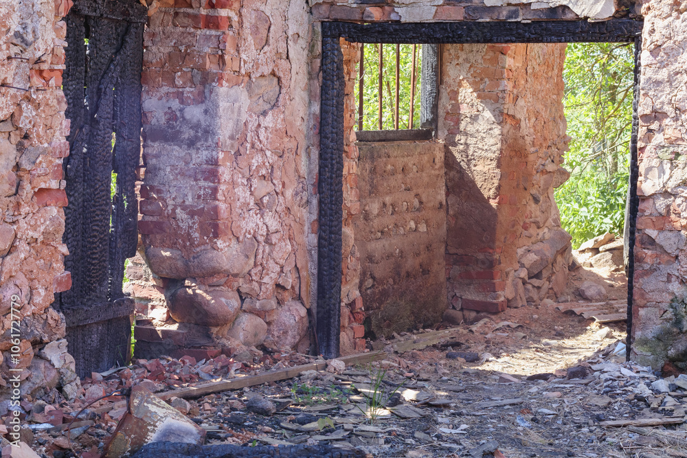 a burnt building with remaining stone walls
a burnt building with remaining stone walls