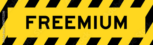 Yellow and black color with line striped label banner with word freemium