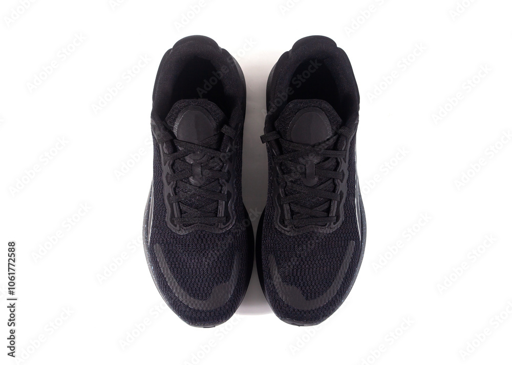 Unbranded black sports shoes photographed isolated on a white background Unbranded black sports shoes photographed isolated on a white background