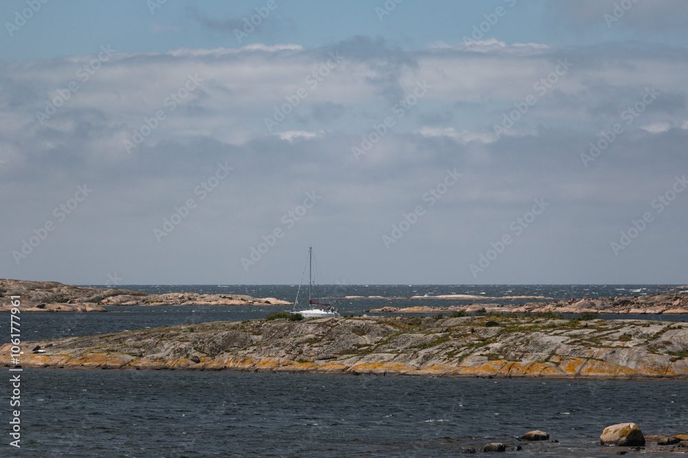 Fototapeta premium scissor islands off smögen in sweden, with bright sunshine and small white clouds