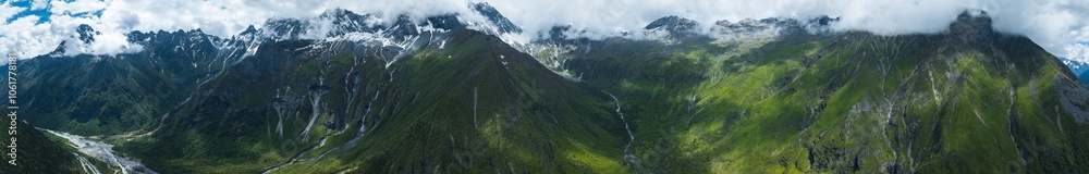 Aerial view of beautiful high altitude snow capped mountain and waterfall landscape Aerial view of beautiful high altitude snow capped mountain and waterfall landscape