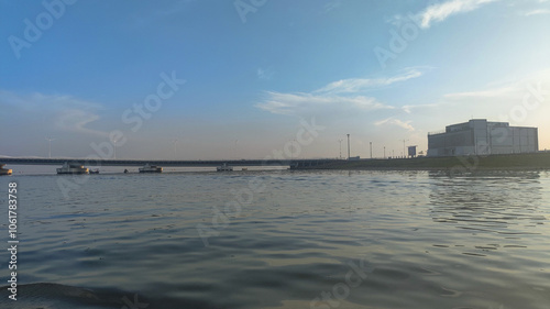 view of Mantra PIK buildings and bridges from the waters of the Kamal Sea photo