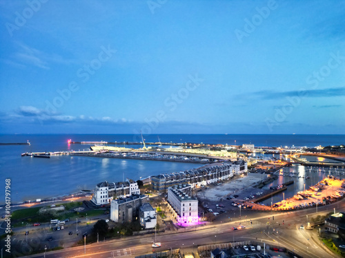 High Angle Night View of Dover Coastal City of South Eastern County of Kent England, United Kingdom. The Illuminated Footage Was Captured with Drone's Camera after Sunset Night of April 20th, 2024 photo